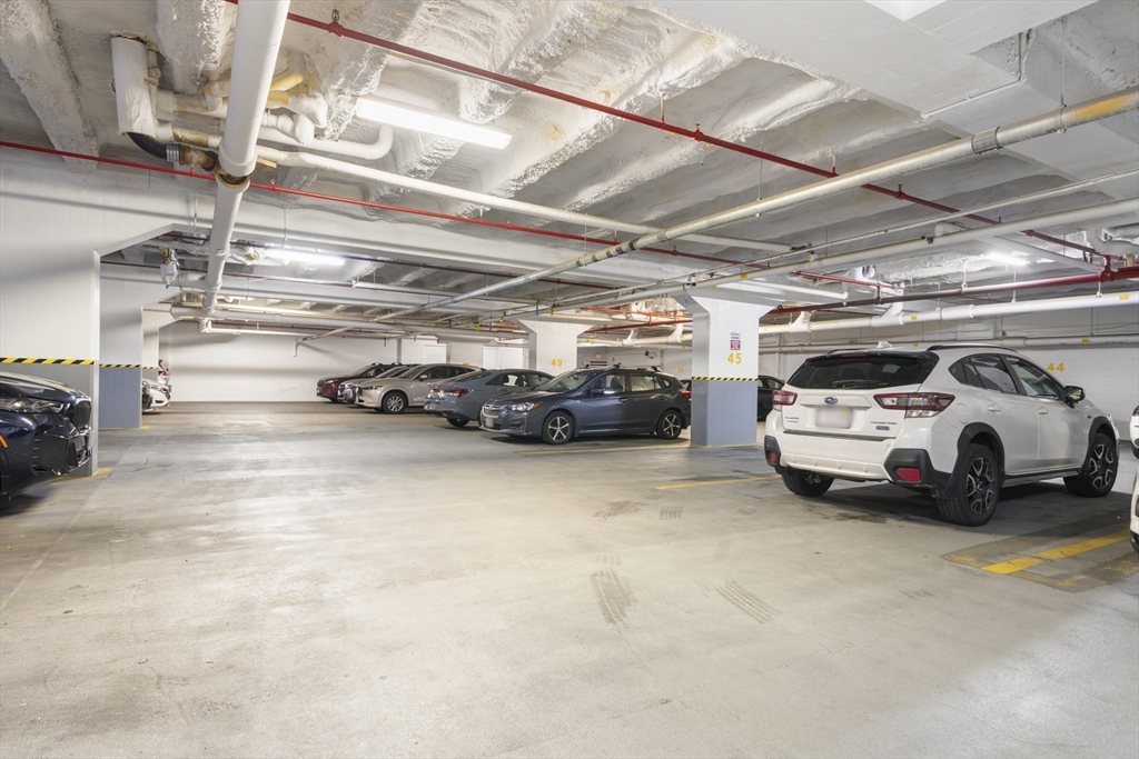 12 Stoneholm Street, Unit PKG:A Boston, MA 02115 - Photo 7 of 10 a view of parking garage with cars