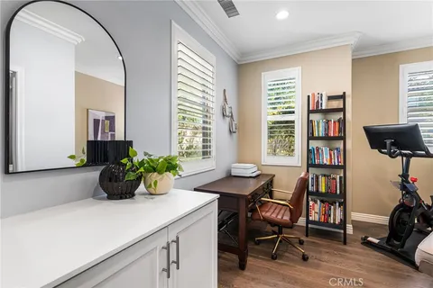 a bedroom with furniture and a window