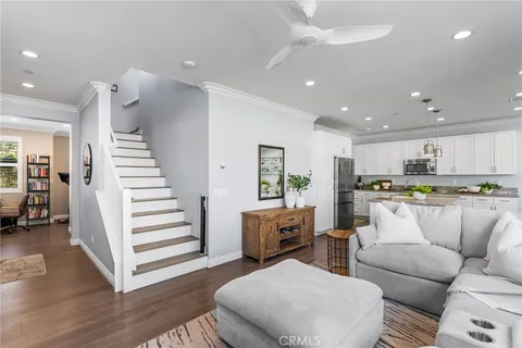 a bedroom with a bed table and a chandelier