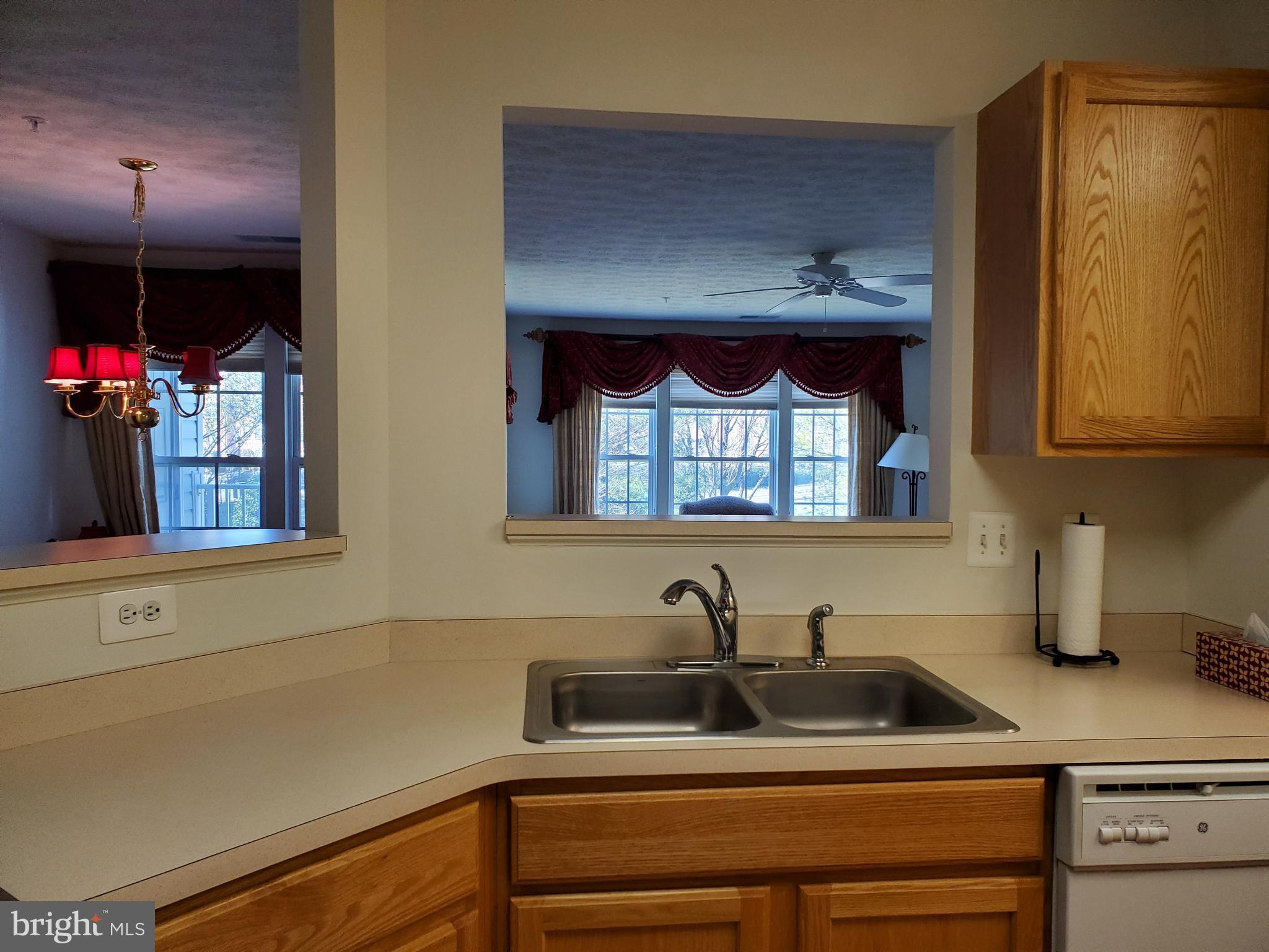 9600 Haven Farm Road, Unit F Perry Hall, MD 21128 - Photo 9 of 36 Kitchen Dual Sink and Pass Through Views