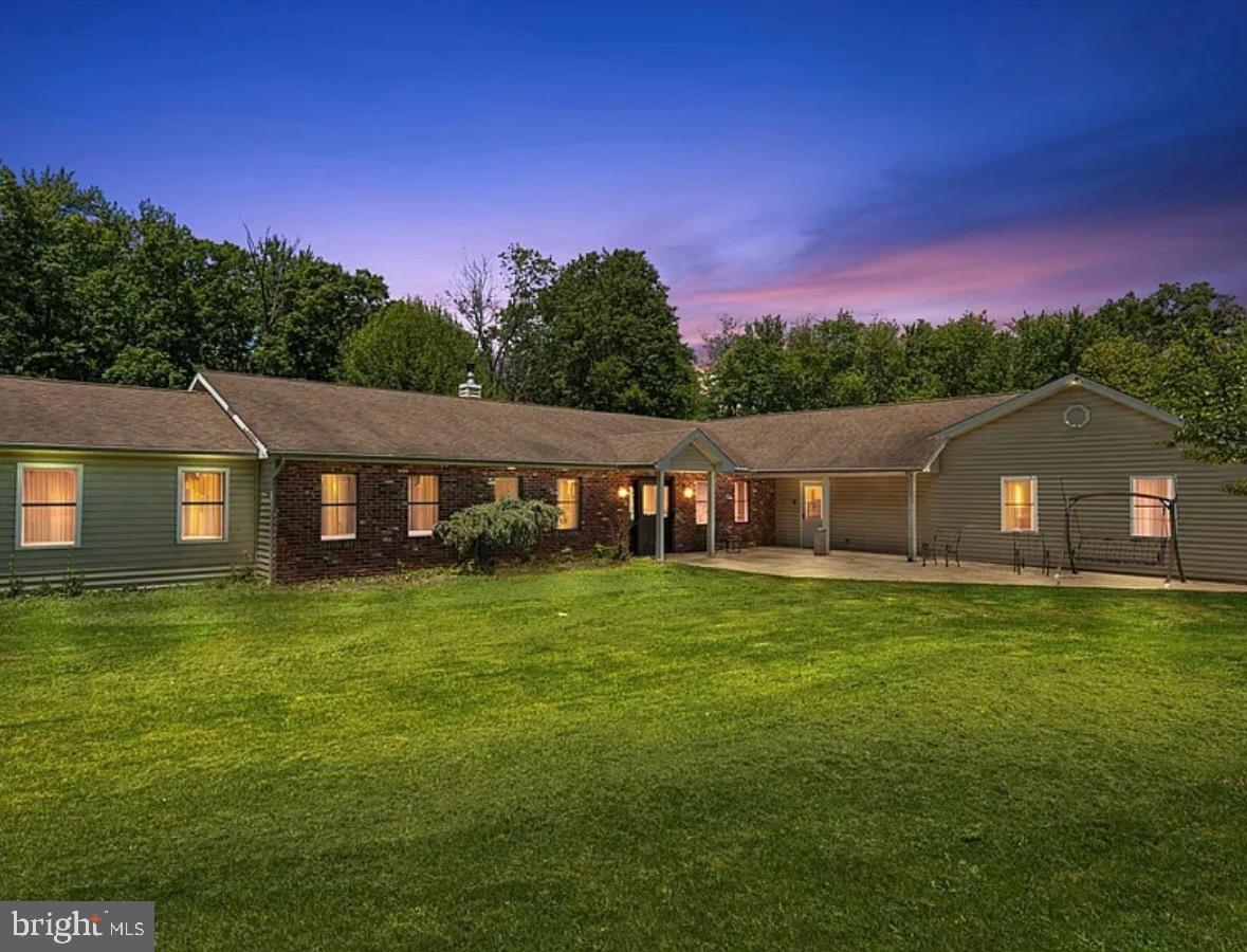 3789 Stump Road Doylestown, PA 18902 - Photo 4 of 33 a backyard of a house with table and chairs