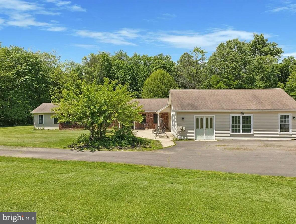 3789 Stump Road Doylestown, PA 18902 - Photo 5 of 33 a front view of a house with a yard