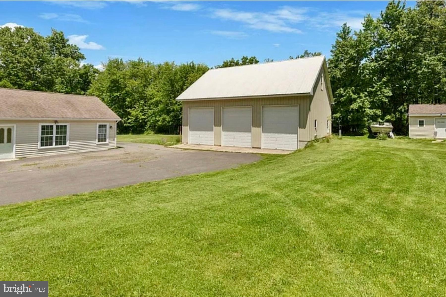 3789 Stump Road Doylestown, PA 18902 - Photo 6 of 33 a front view of a house with a garden and yard