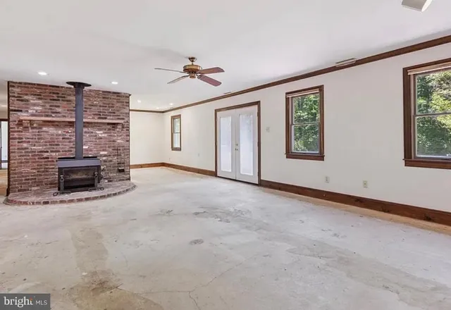 a view of livingroom with furniture and chandelier fan