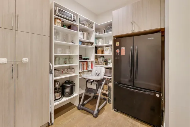 a view of walk in closet with empty racks