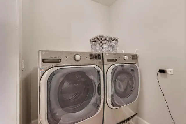 a living room with furniture and a night stand