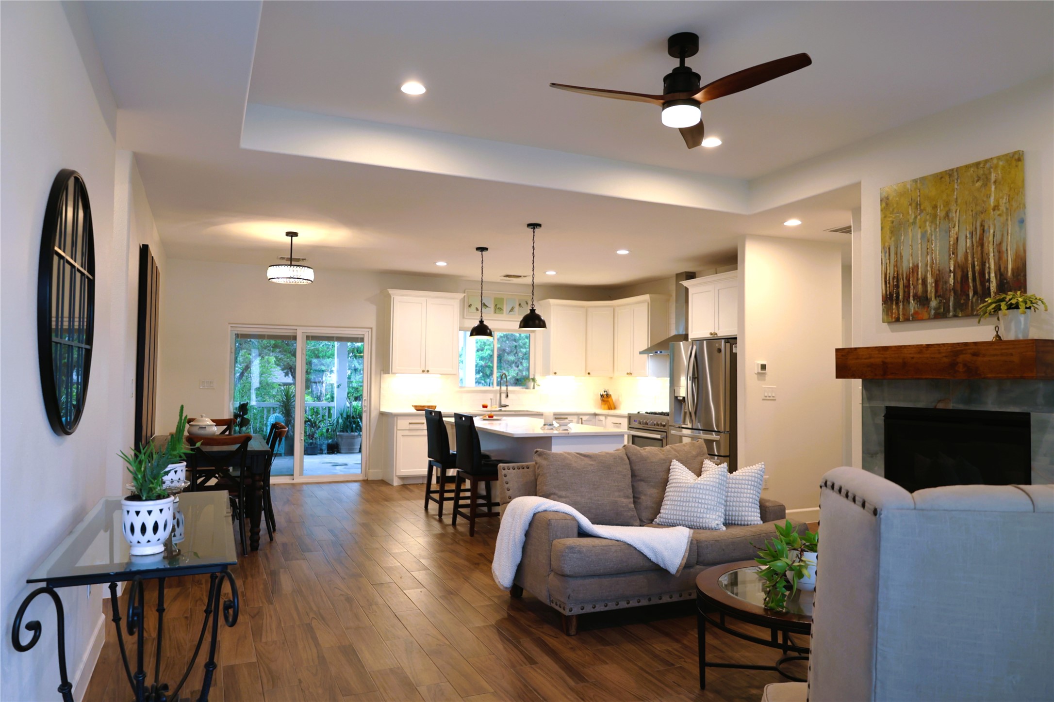 20602 Oak Ridge Lago Vista, TX 78645 - Photo 3 of 35 Warm wood flooring and a modern fireplace define this open and inviting living space.