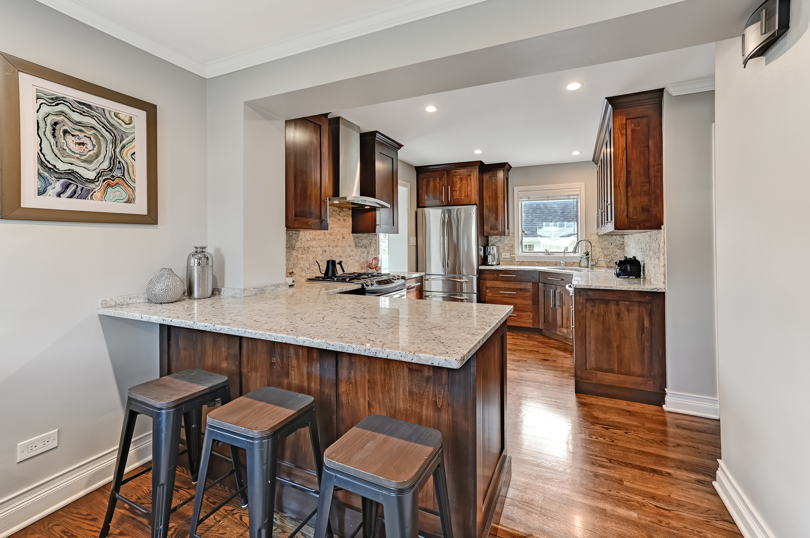 447 Ridge Avenue Clarendon Hills, IL 60514 - Photo 13 of 39 a kitchen with a sink cabinets and wooden floor