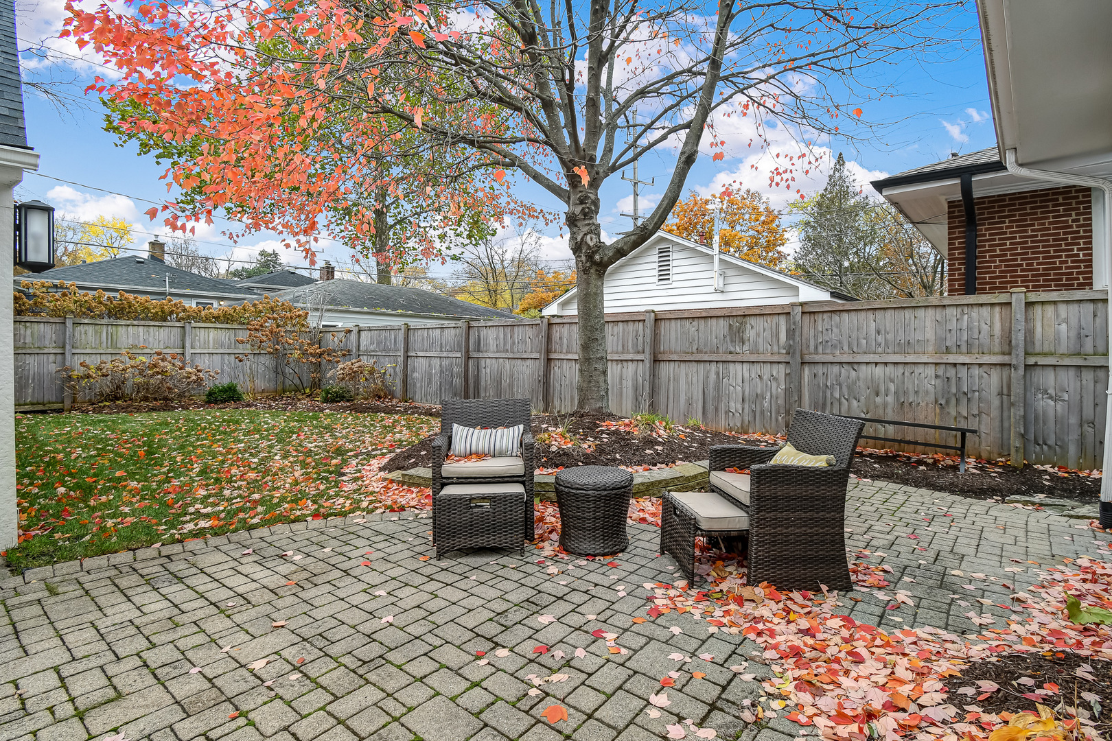 447 Ridge Avenue Clarendon Hills, IL 60514 - Photo 33 of 39 a view of a patio with table and chairs with wooden fence