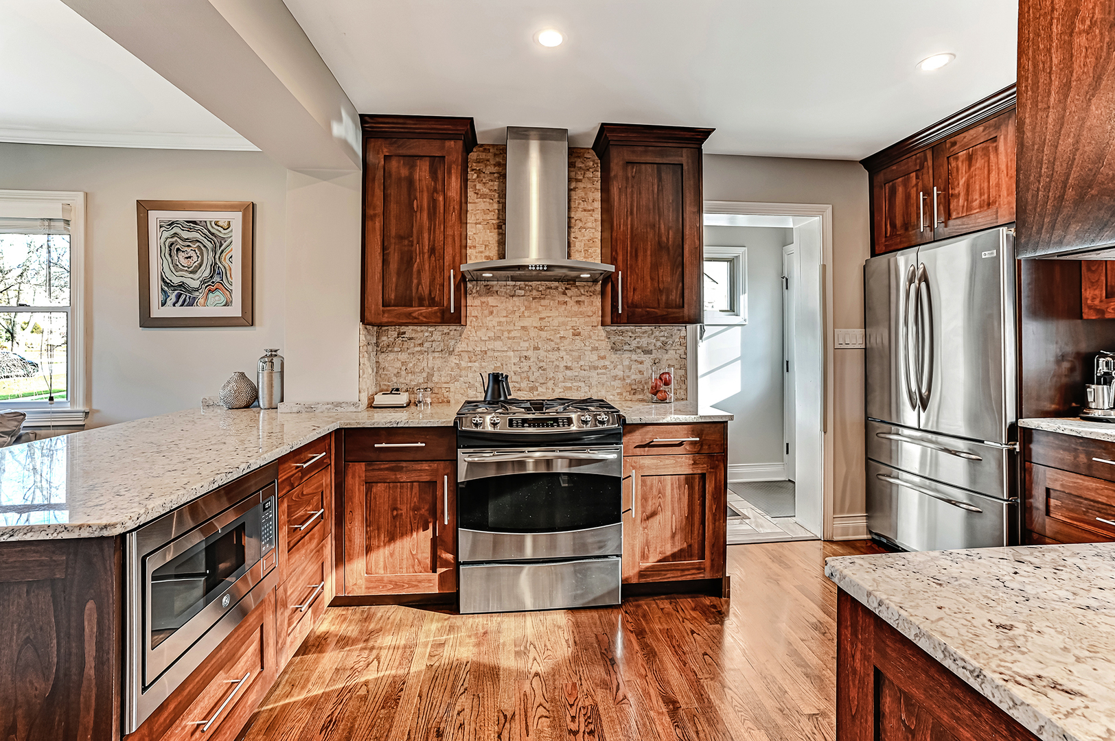 447 Ridge Avenue Clarendon Hills, IL 60514 - Photo 10 of 39 a kitchen with stainless steel appliances granite countertop a stove a sink and a refrigerator