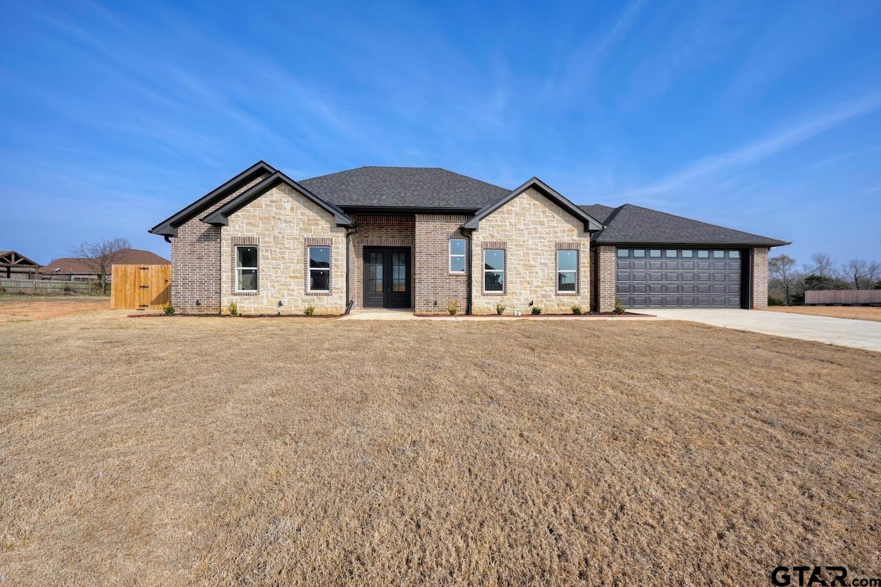636 Prince Lane Tyler, TX 75704 - Photo 1 of 38 a view of a house with a yard