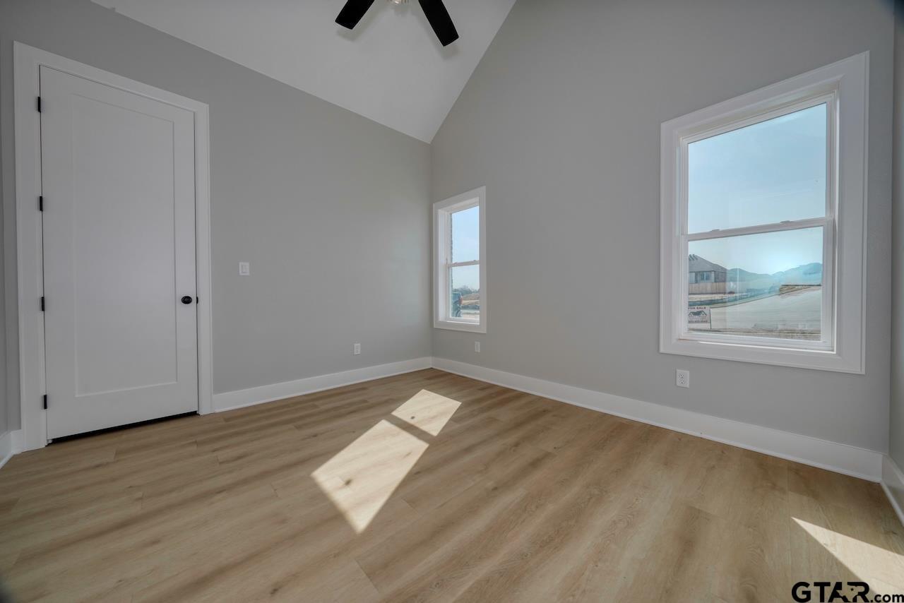 636 Prince Lane Tyler, TX 75704 - Photo 23 of 38 a view of empty room with wooden floor and fan