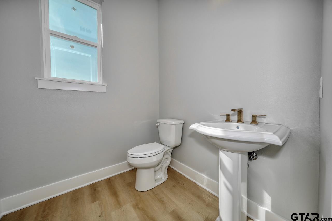 636 Prince Lane Tyler, TX 75704 - Photo 25 of 38 a bathroom with a sink toilet and a mirror