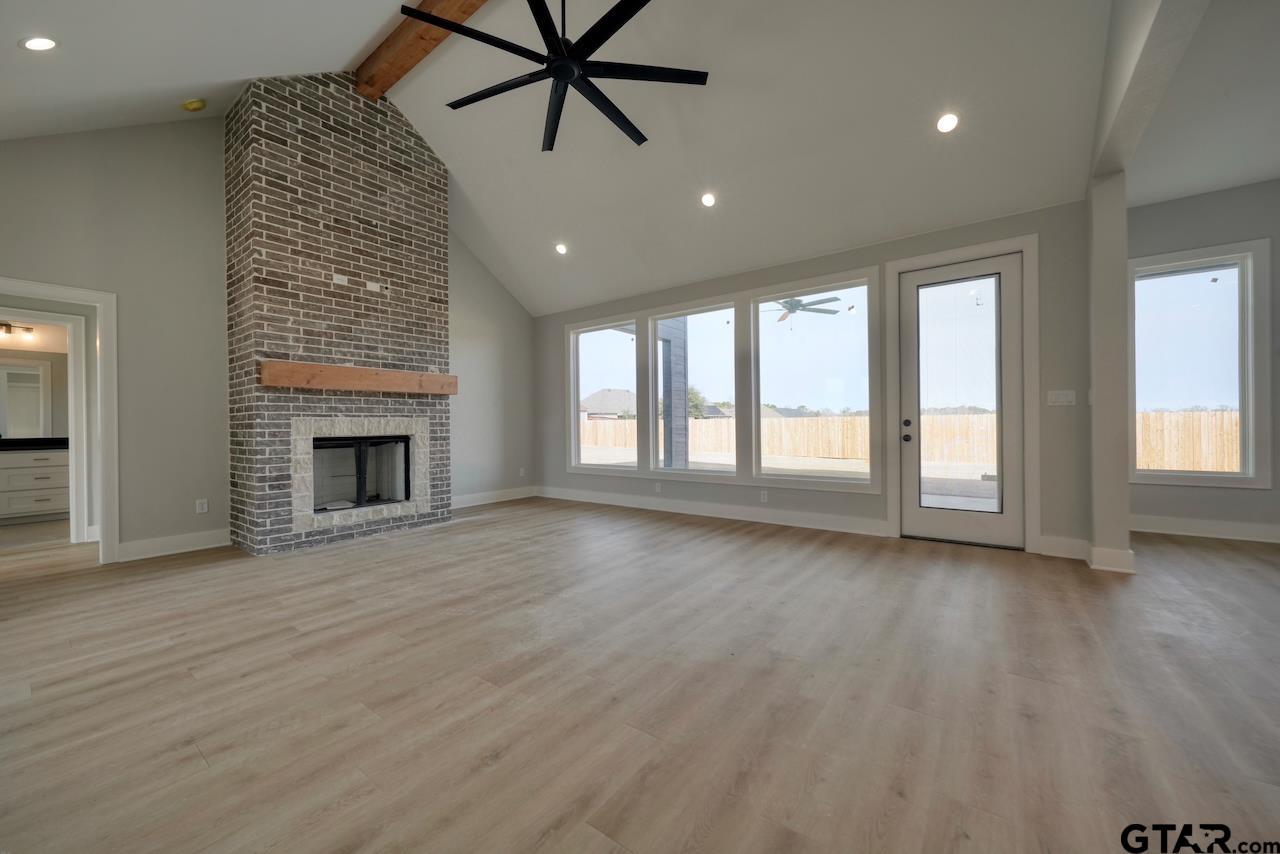 636 Prince Lane Tyler, TX 75704 - Photo 4 of 38 an empty room with windows and fireplace