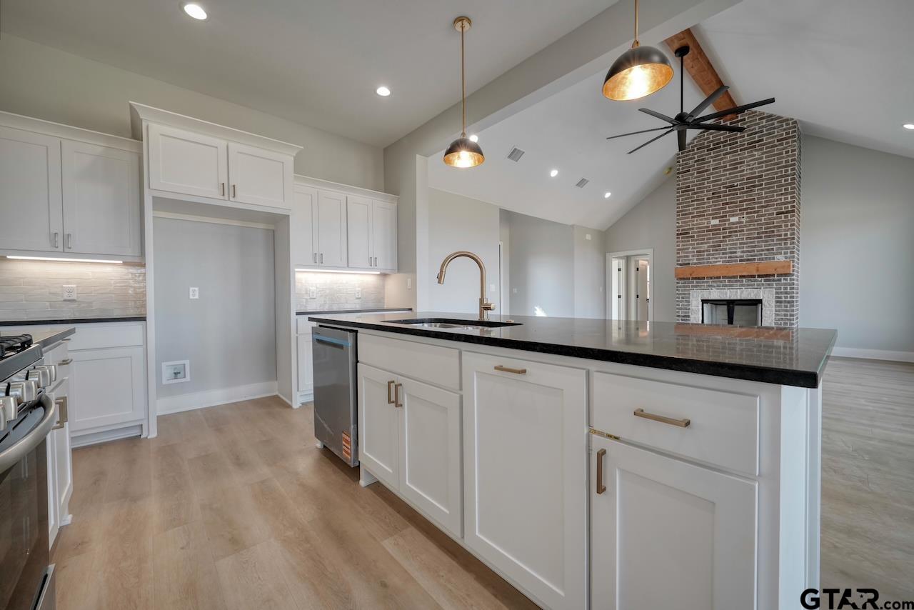 636 Prince Lane Tyler, TX 75704 - Photo 10 of 38 a kitchen with granite countertop a sink and window
