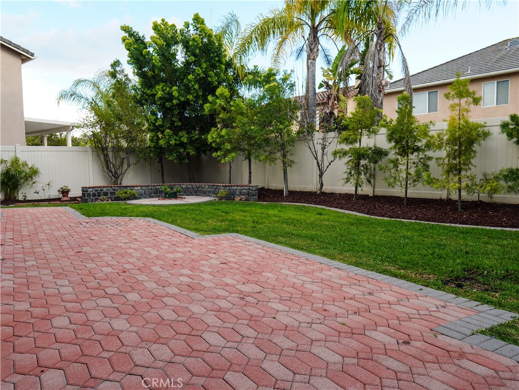 26 Colorado Irvine, CA 92606 - Photo 22 of 26 a view of a house with a yard and palm trees