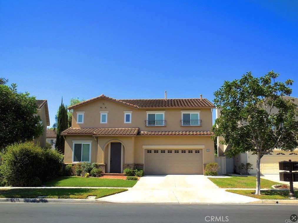 26 Colorado Irvine, CA 92606 - Photo 23 of 26 a front view of a house with a garden and yard