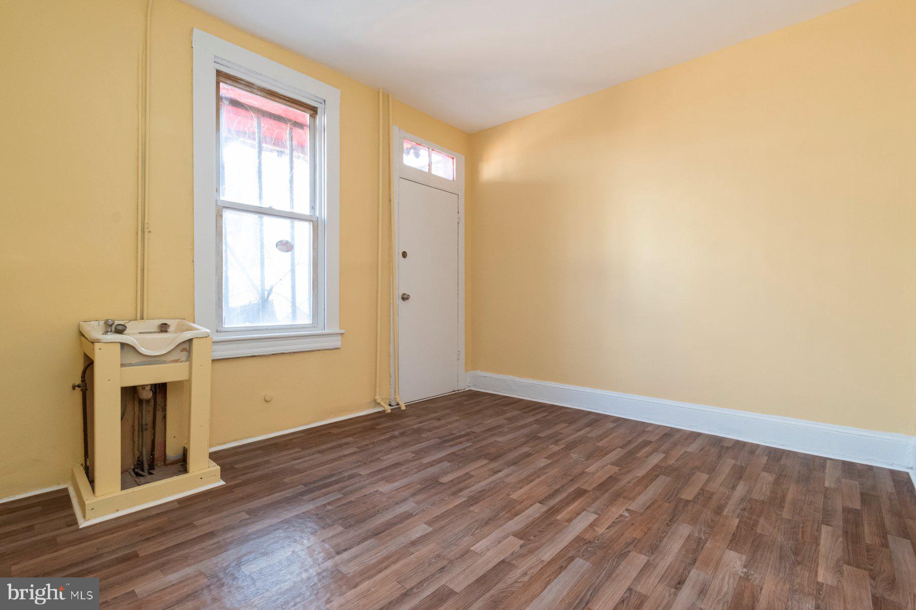 2273 Reisterstown Road Baltimore, MD 21217 - Photo 15 of 27 a view of empty room with wooden floor and fan