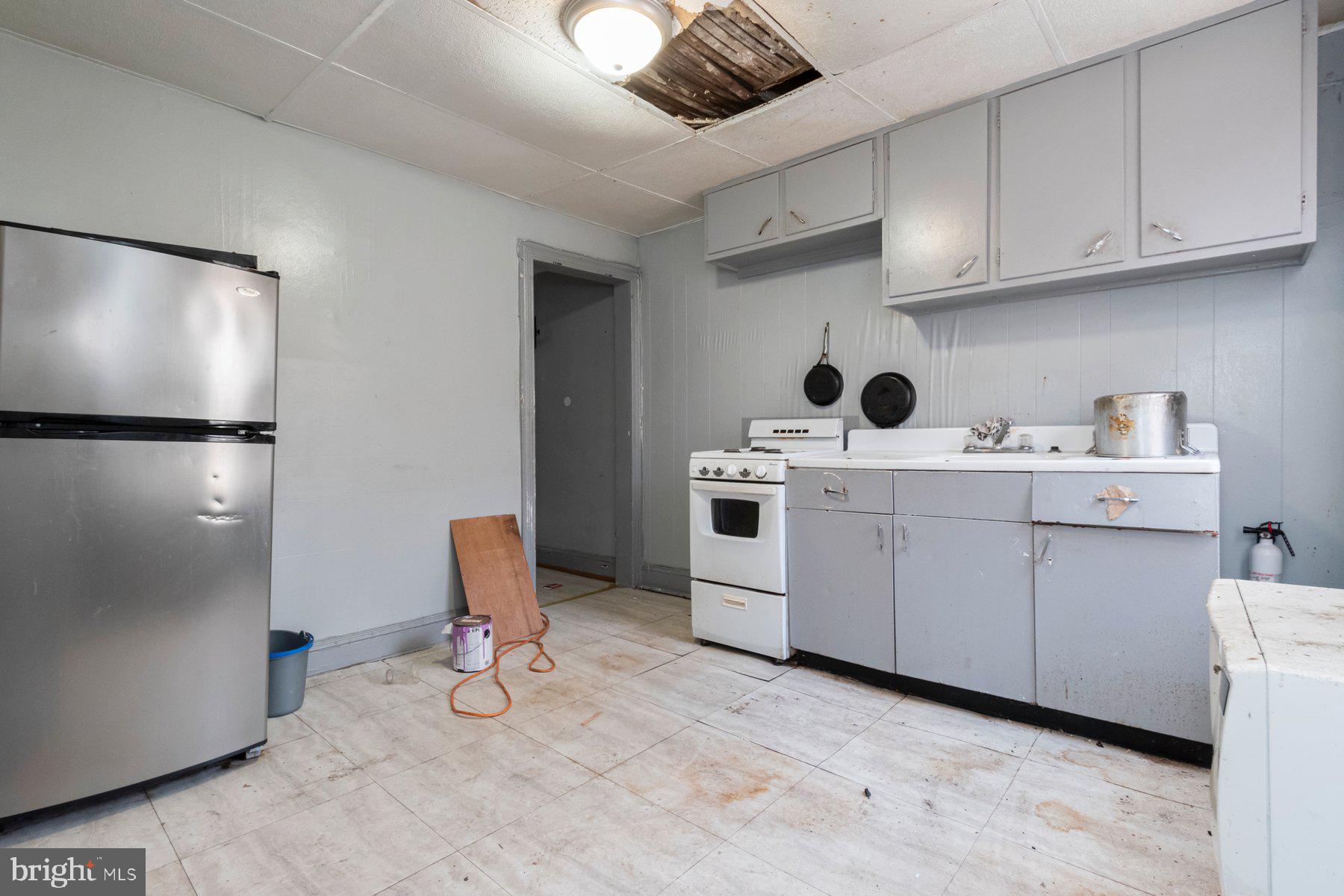 2273 Reisterstown Road Baltimore, MD 21217 - Photo 16 of 27 a kitchen with white cabinets and white appliances