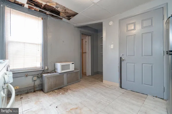 a kitchen with a stove a sink and a refrigerator
