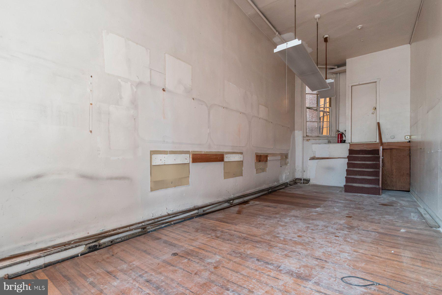 2273 Reisterstown Road Baltimore, MD 21217 - Photo 5 of 27 a view of an empty room with a window