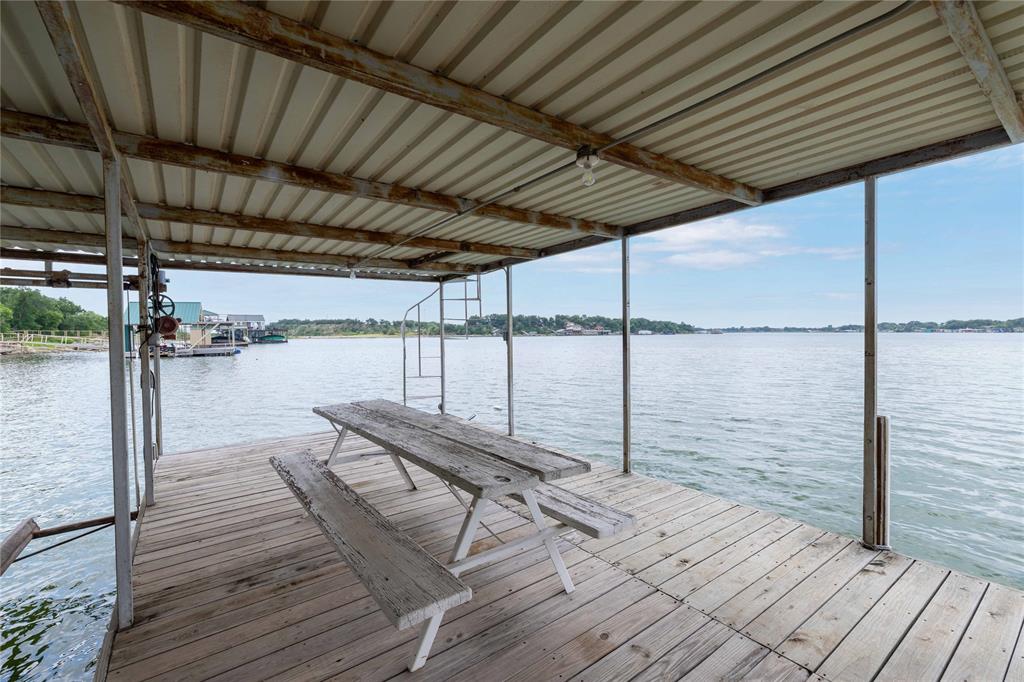 977 Deep Water Road May, TX 76857 - Photo 22 of 36 a view of a balcony with a chair