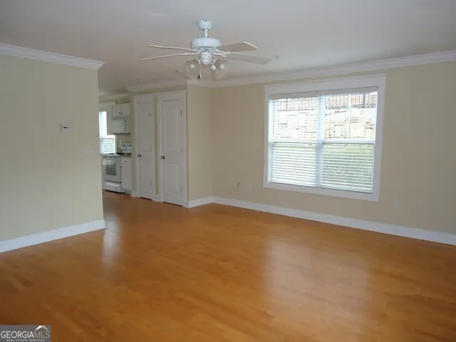 a view of an empty room with a window