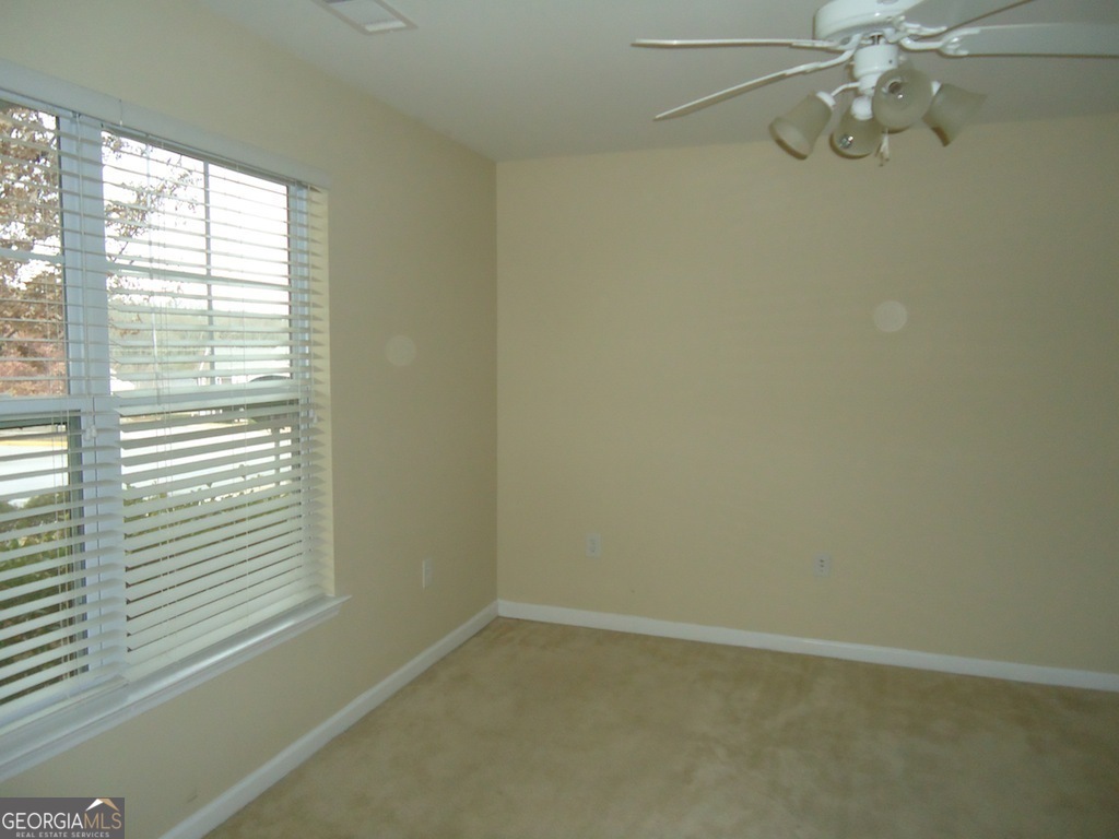 1035 South Barnett Shoals Road, Unit 1012 Athens, GA 30605 - Photo 13 of 27 a view of an empty room with a window