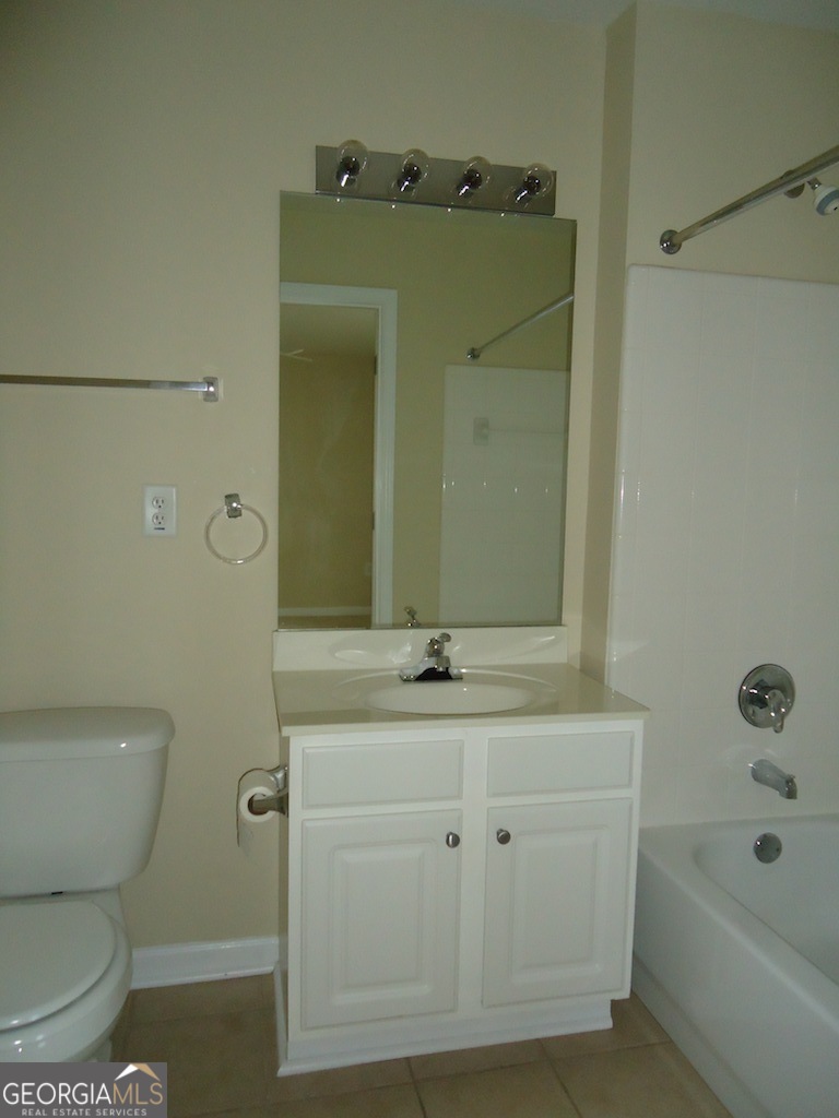 1035 South Barnett Shoals Road, Unit 1012 Athens, GA 30605 - Photo 15 of 27 a bathroom with a sink a toilet and shower