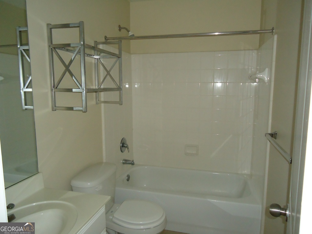 1035 South Barnett Shoals Road, Unit 1012 Athens, GA 30605 - Photo 19 of 27 a bathroom with a shower and a toilet