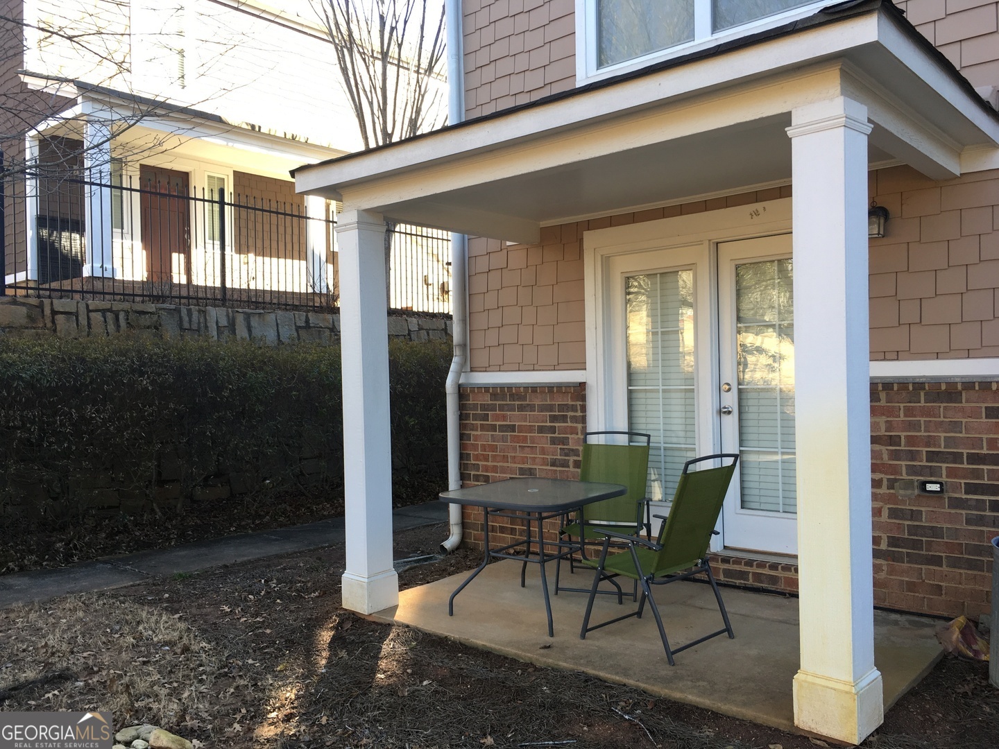 1035 South Barnett Shoals Road, Unit 1012 Athens, GA 30605 - Photo 2 of 27 a view of a house with backyard and sitting area