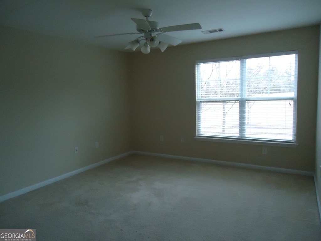 1035 South Barnett Shoals Road, Unit 1012 Athens, GA 30605 - Photo 21 of 27 an empty room with a window