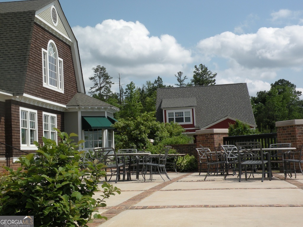 1035 South Barnett Shoals Road, Unit 1012 Athens, GA 30605 - Photo 4 of 27 a view of house with yard and sitting area