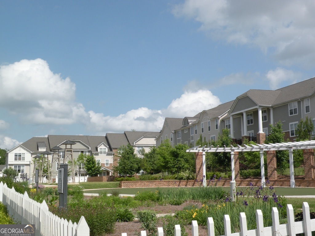 1035 South Barnett Shoals Road, Unit 1012 Athens, GA 30605 - Photo 6 of 27 a front view of a house with a yard