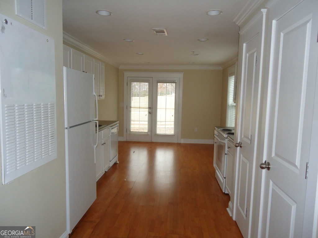 1035 South Barnett Shoals Road, Unit 1012 Athens, GA 30605 - Photo 10 of 27 a view of a hallway with wooden floor and staircase