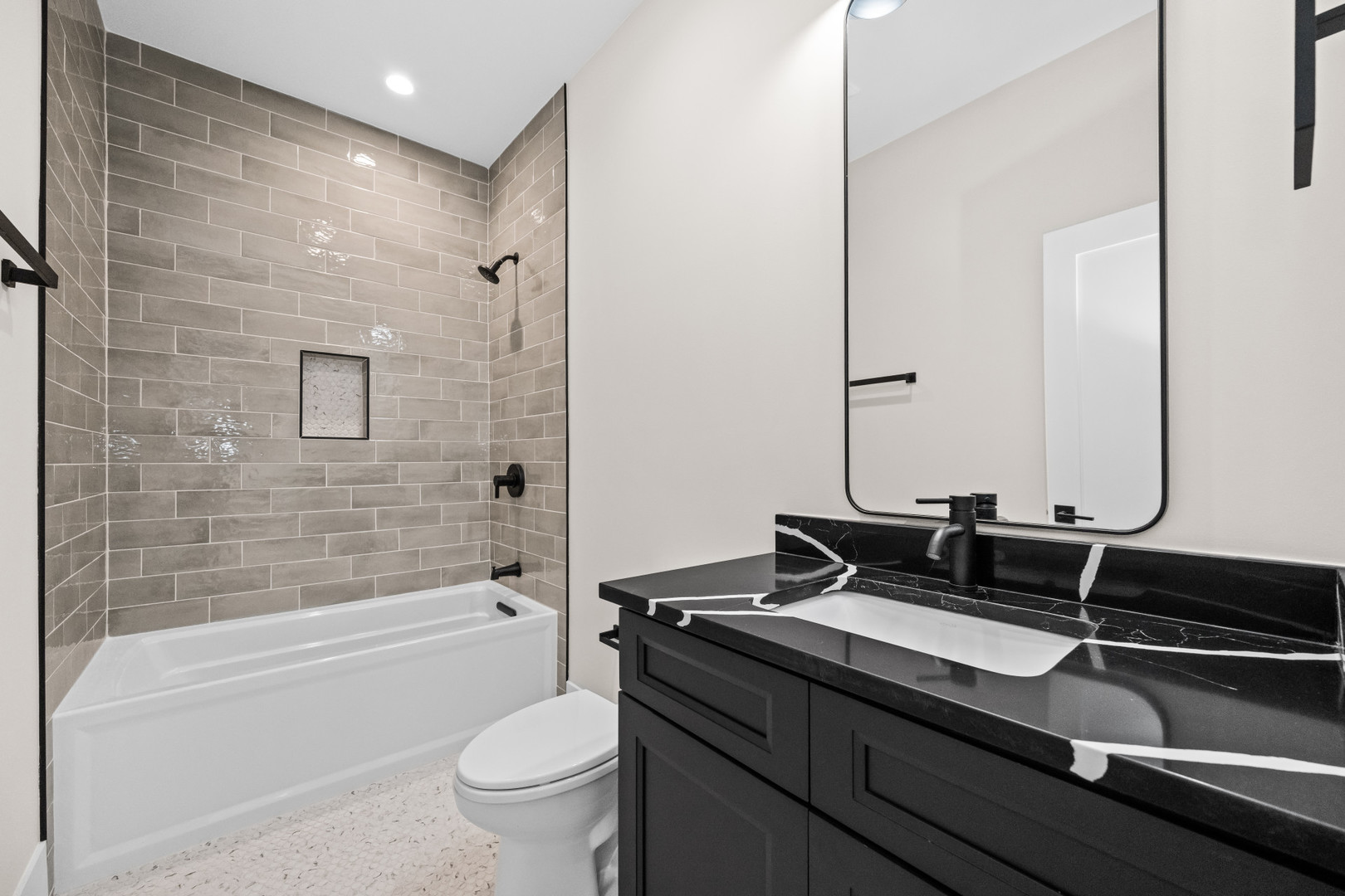 7827 South Merrill Avenue Chicago, IL 60649 - Photo 17 of 42 a bathroom with a double vanity sink toilet and shower