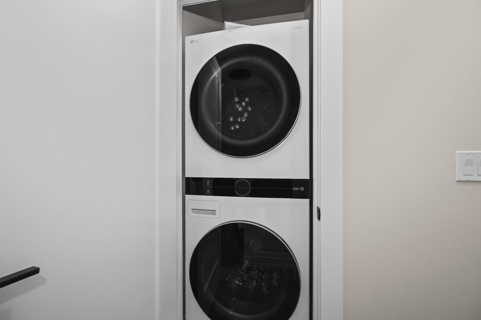7827 South Merrill Avenue Chicago, IL 60649 - Photo 27 of 42 a view of a hallway with washer and dryer