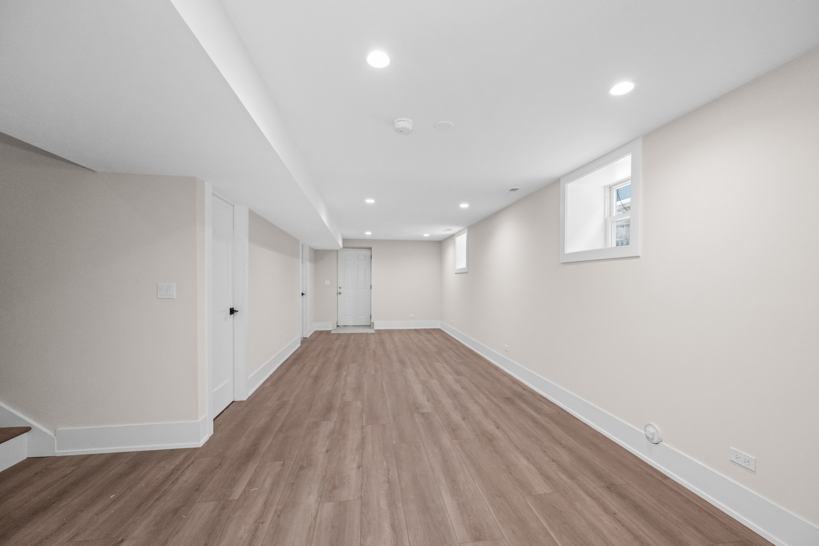 7827 South Merrill Avenue Chicago, IL 60649 - Photo 32 of 42 a view of an empty room with wooden floor