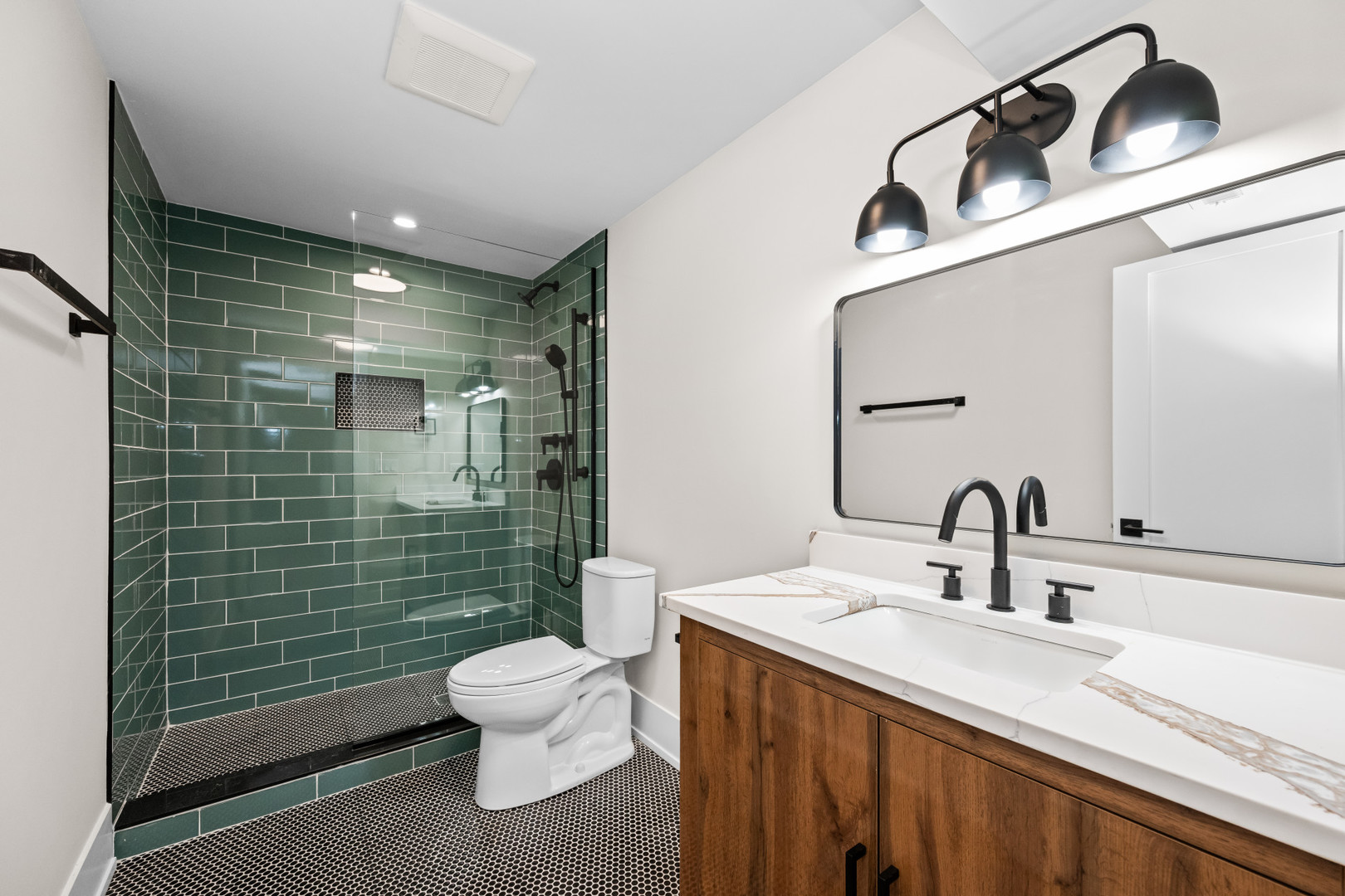 7827 South Merrill Avenue Chicago, IL 60649 - Photo 33 of 42 a bathroom with a sink a toilet and shower