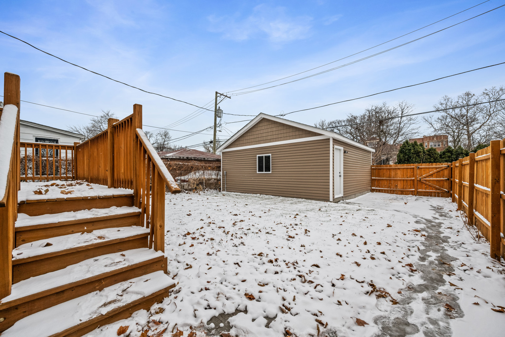 7827 South Merrill Avenue Chicago, IL 60649 - Photo 36 of 42 a view of a house with a snow
