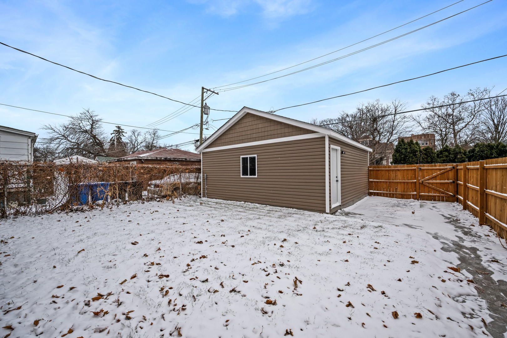 7827 South Merrill Avenue Chicago, IL 60649 - Photo 38 of 42 a backyard of a house with table and chairs