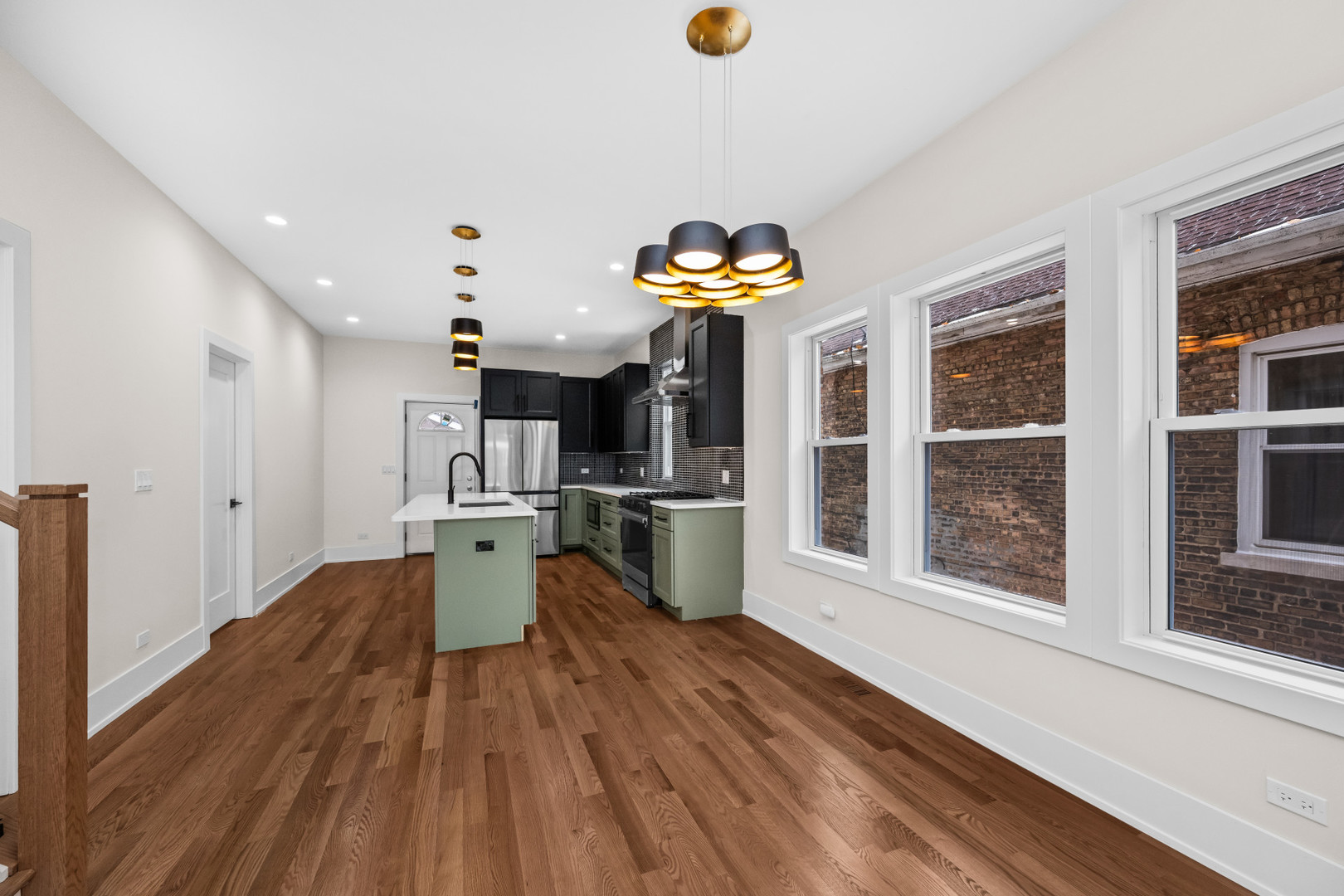 7827 South Merrill Avenue Chicago, IL 60649 - Photo 10 of 42 a very nice looking room with a large window and wooden floor