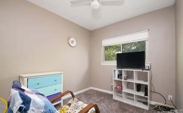 a view of a livingroom with furniture and a flat screen tv