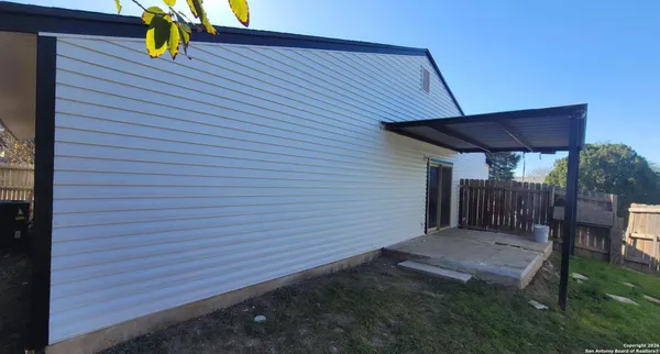 a view of a backyard with a patio