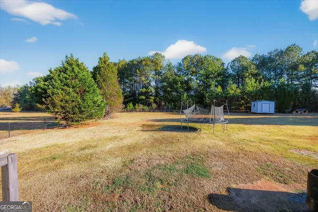 a view of a swimming pool with an outdoor space and seating area