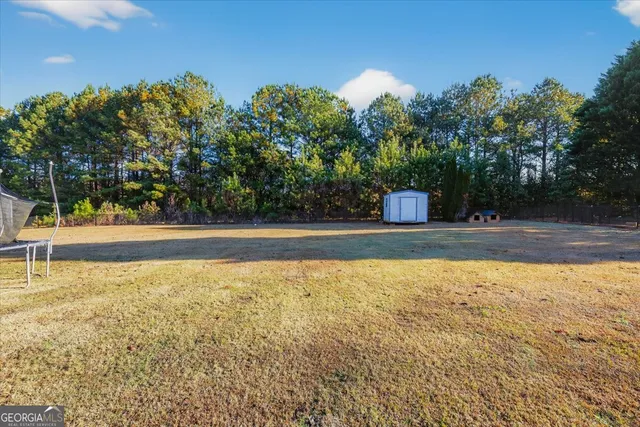a view of a swimming pool with a bench