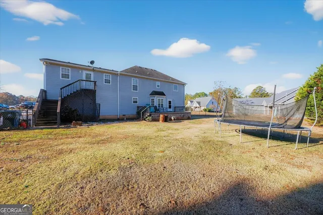 a house view with a backyard space