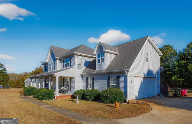 a front view of a house with a yard