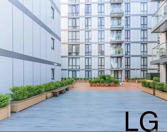 a street view with building and garden space