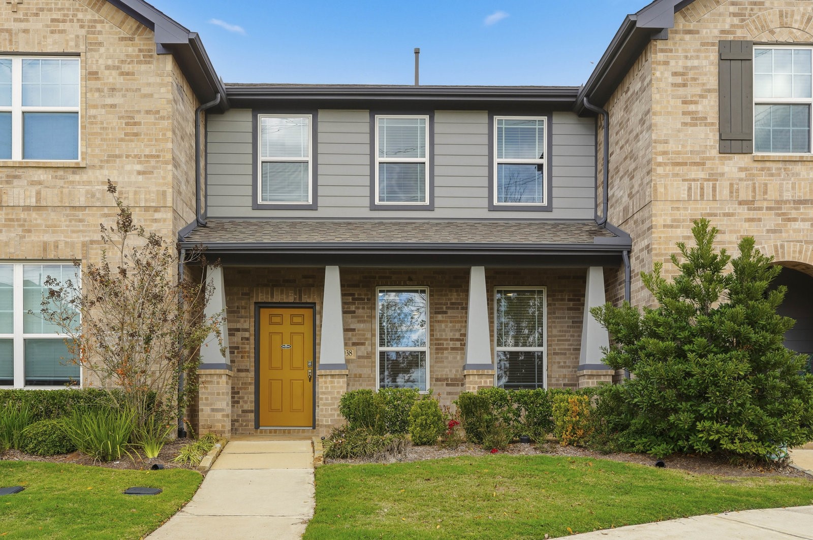 8038 Scanlan Trace Missouri City, TX 77459 - Photo 1 of 25 a front view of a house with garden